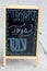 Pretty wood and chalkboard sign that reads the word TOYS, an open invitation to shoppers