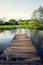 Pretty wooden pier at pond during sunset, colorful summer day, new life change concept, fresh start, new year resolution