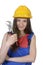 Pretty worker woman with pliers and hard hat