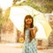 Pretty young asian girl in the rain