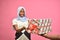 pretty young black lady smiling while receiving a gift box from someone