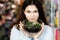 Pretty young brunette girl holding a beautiful terrarium with cactus in her hands. Time for gifts