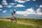 Pretty, young female biker outdoors on her mountain bike