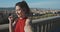 Pretty young girl enjoying the sunny weather on the viewpoint in Florence. Travelling as lifestyle. Portrait of smiling