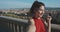 Pretty young girl enjoying the sunny weather on the viewpoint in Florence. Travelling as lifestyle. Portrait of smiling