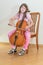 Pretty young girl practice playing cello