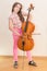 Pretty young girl practice playing cello