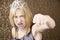 Pretty young girl with a tiara throws a punch