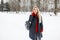 Pretty young model girl in fashion coat with a red sweater