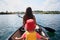 Pretty young mother and little toddler son canoeing in lake