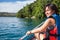 Pretty, young woman on a canoe on a lake