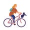 Pretty young woman dressed in casual clothes riding bike with cat sitting in basket. Cute girl on bicycle with her pet