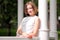 Pretty young woman in a gazebo in park