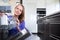 Pretty, young woman in her modern and well equiped kitchen