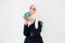 Pretty young woman in hijab hugging a little earth globe. Planet care, save the earth, ecology, travel concept.