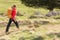 Pretty, young woman hiking in mountains