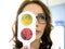 Pretty young woman optometrist ophthalmologist optician performs a color blindness test