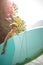 Pretty, young woman paddling on a paddle board on a lake