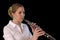 Pretty young woman playing Oboe