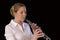 Pretty young woman playing Oboe