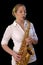 Pretty young woman playing saxophone