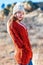 Pretty young woman in rust colored cardigan sweater