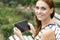 Pretty young woman shopping online with tablet device