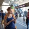 Pretty, young woman in a trainstation, waiting for her train