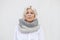 Pretty young woman in warm grey wool knitted snood