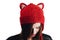 Pretty young woman wearing a hand knitted red hat on white background. Isolated. Beautiful girl in with Ear flap.