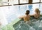 Pretty young women relaxing in the whirlpool bathtub