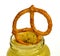 Pretzel in jar of mustard