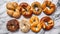 pretzels baked pastry with various toppings on a marble table