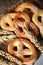 Pretzels with sesame seeds on wooden table