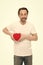 Preventing heart attack. Valentines man holding red toy heart in hands. Handsome mature man with valentines day heart