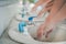 Preventing the spread of COVID-19 by washing your hands with soapy water and rubbing your nails and fingers frequently or using
