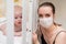 Prevention of the epidemic of coronavirus and covid-19. A mother in a protective mask looks after a baby who is in quarantine at