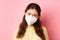 Preventive measures, health care concept. Close up of sad young woman in medical respirator express compassion, look