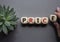 Price symbol. Wooden cubes with word Price. Businessman hand. Beautiful grey background with succulent plant.