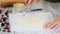 Pricking puff pastry sheet with fork. Making Puff Pastry Cake