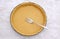 Pricking shortcrust pastry case with a metal fork