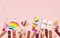 Pride festive banner background with multi ethnic hands, flags, megaphones and copy space for LGBTQIA+ Pride month, love diversity