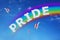 Pride sign made of clouds and rainbow in sky