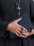 Priest with bible and rosary