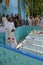 The priest blesses religious objects at the tomb of a Croatian missionary, Jesuit father Ante Gabric in Kumrokhali, India