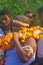 A priest bringing the holy water for the worship of Lord Shiva. the villagers enjoys the programme