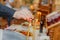 Priest hand burning hair in candle light at church