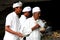 A priest and his assistant in Bali, Indonesia