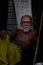 Priest portrait image in Badavilinga Temple with stick wearing yellow dhoti /Shiva Linga Hampi