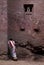 Priest praying outside church in lalibela ethiopia